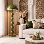 Olive green sculptural floor lamp placed in a luxury living room with beige sofa, decorative pillows, and Islamic-inspired wall panels.